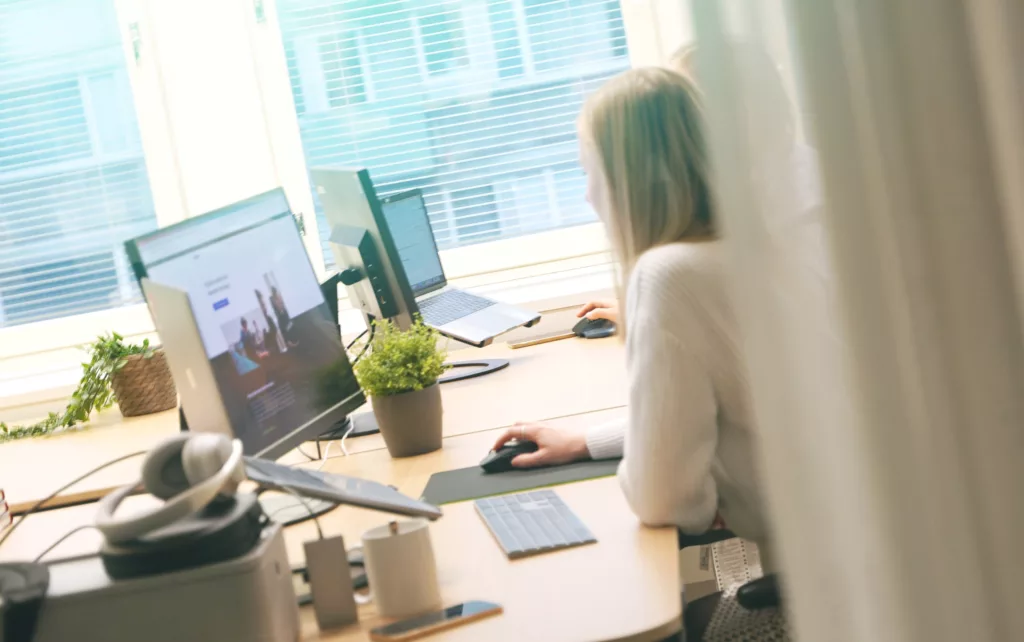 A person working on a computer at an office